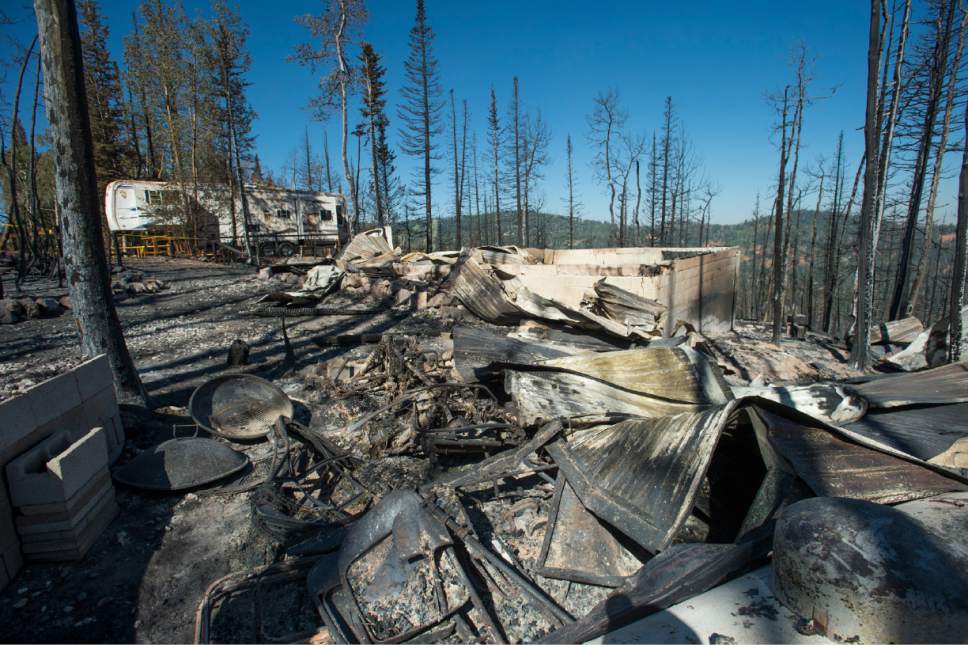 Rick Egan  |  The Salt Lake Tribune


The remains of the cabin that burned to the ground last week in the ski resort town of Brian Head on Friday, June 30, 2017.