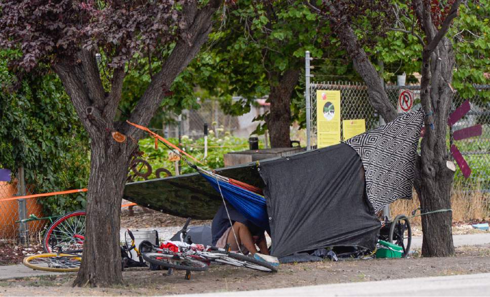 Francisco Kjolseth | The Salt Lake Tribune
Homeless gather for the day with their belongings at many small camps near the downtown shelter on Tuesday, July 25, 2017, as the conversation continues on how to address the ongoing homeless issue.