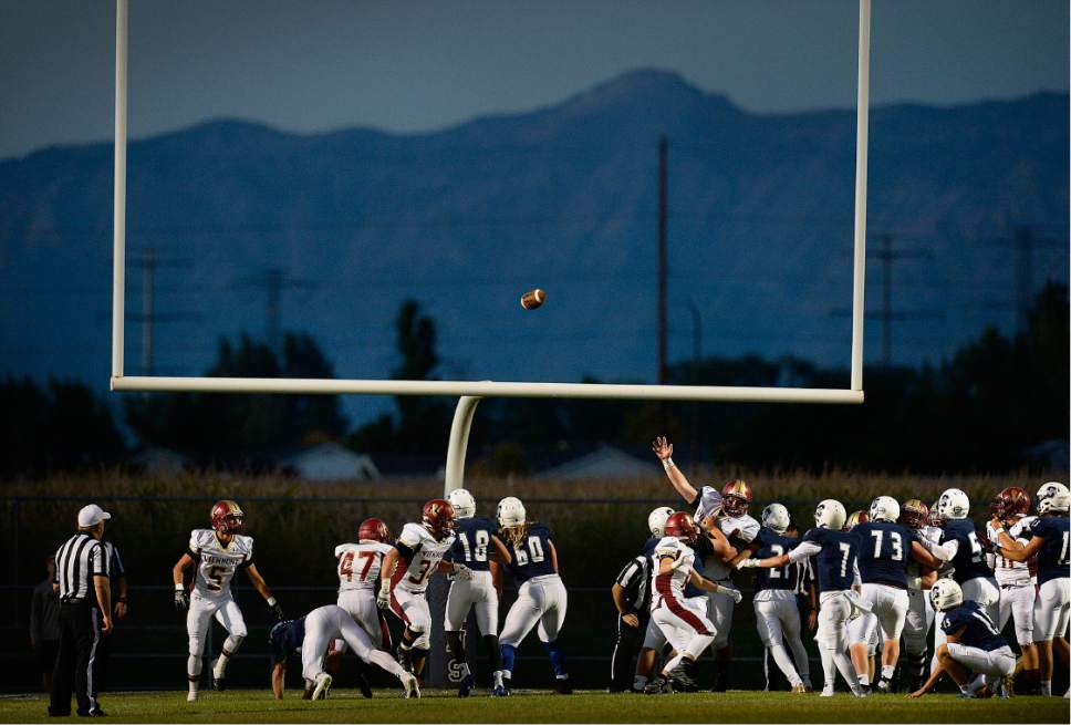 Scott Sommerdorf   |  The Salt Lake Tribune  
Viewmont tries in vain to block a Syracuse PAT in the early Fall twilight. Syracuse beat Viewmont 13-6, Friday, September 16, 2016.