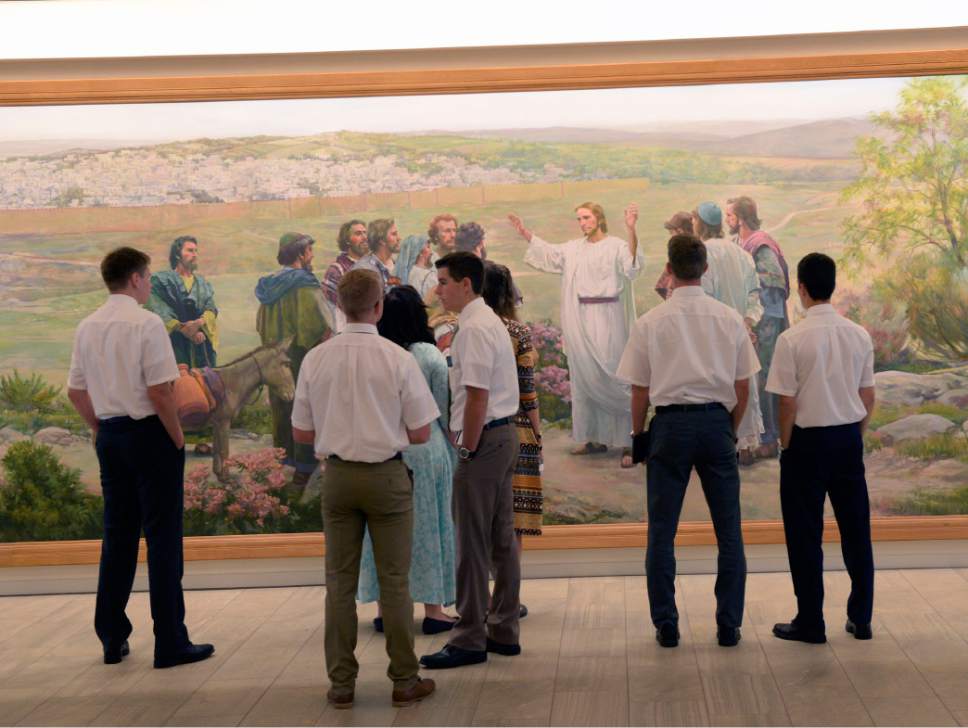 Al Hartmann  |  The Salt Lake Tribune
Missionaries take in the artwork in the new building at the Missionary Training Center in Provo Wednesday July 26.  It opened in June.