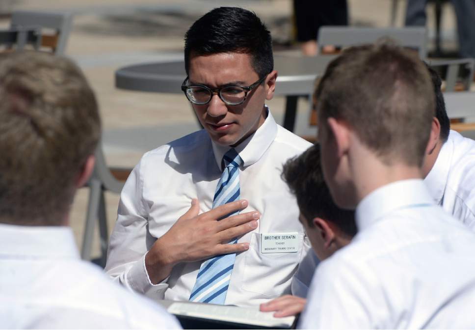 Al Hartmann  |  The Salt Lake Tribune
Small group of missionaries study together on the plaza at the new building at the Missionary Training Center in Provo Wednesday July 26.  The new training building opened in June.