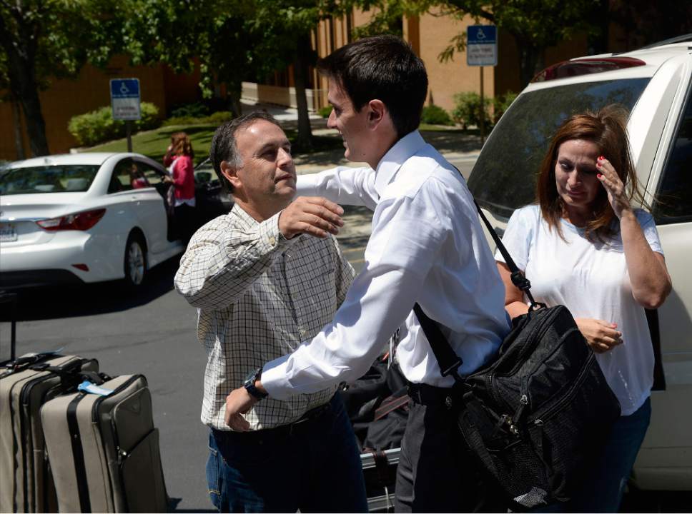 Al Hartmann  |  The Salt Lake Tribune
Missionaries have just enough time to unload their luggage and hug their family members goodbye at the Missionary Training Center in Provo Wednesday July 26.