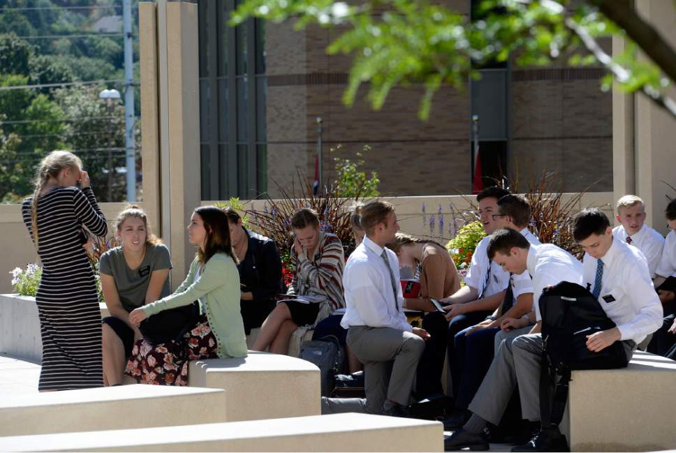Al Hartmann  |  The Salt Lake Tribune
Missionaries study in a small group on the plaza of the new building at the Missionary Training Center in Provo Wednesday July 26.  The new building which opened in June provides numerous places inside and out for contemplation and study.