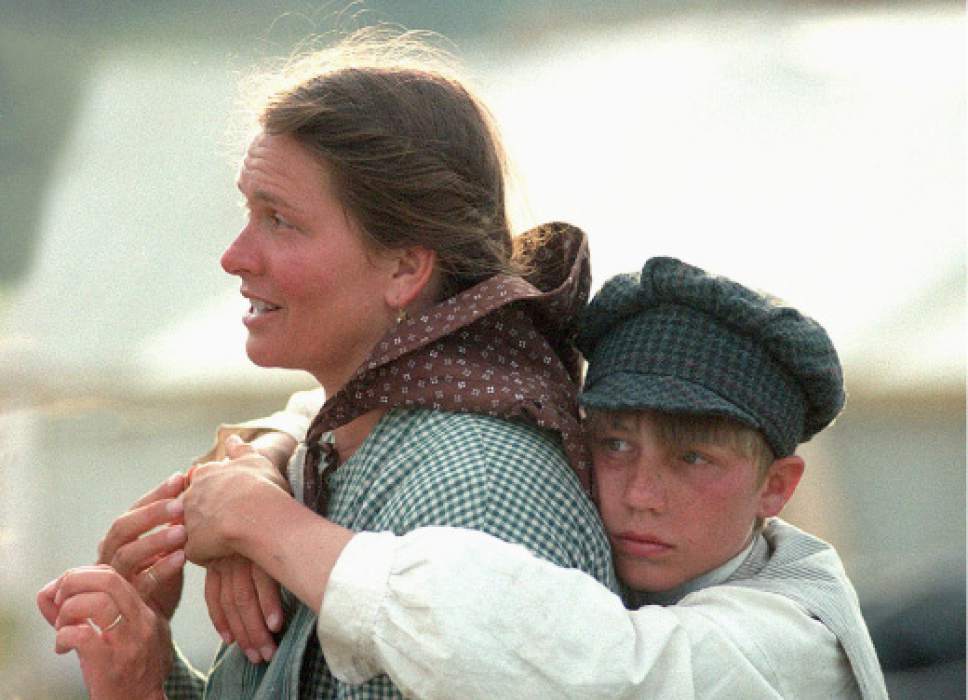 Rick Egan  |  The Salt Lake Tribune

Wendy Sorensen gets a hug from her son, Ben Sorensen, as they camp along the trail in, Nebraska.