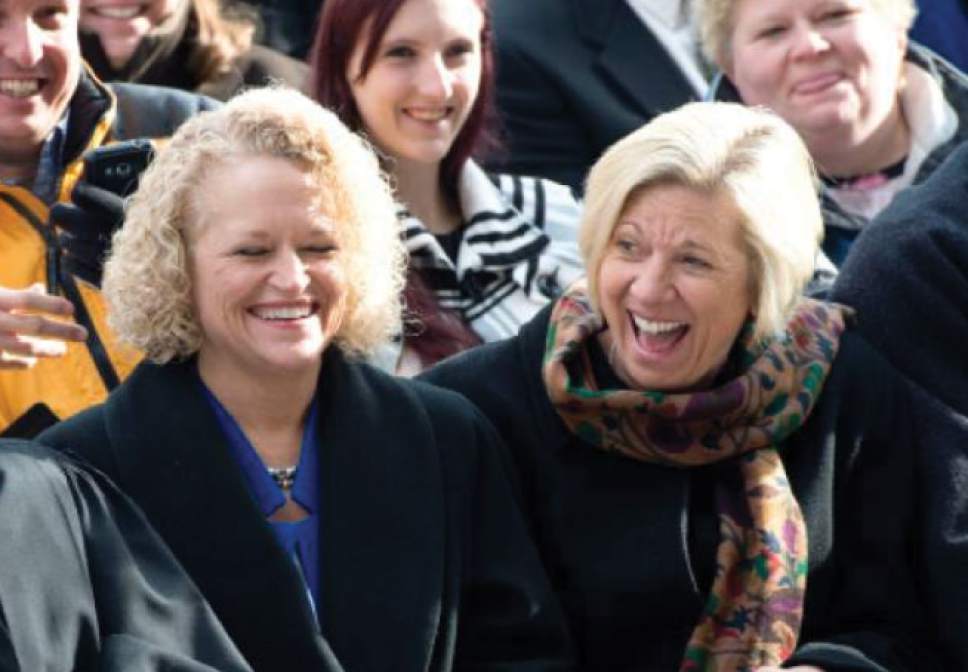(Steve Griffin | Tribune file photo) Salt Lake Mayor Jackie Biskupski laughs with her then-fiancee Betty Iverson, right, during Oath of Office Ceremony for her and council members Andrew Johnston, Derek Kitchen and Charlie Luke at the City & County Building in Salt Lake City, Monday, January 4, 2016.