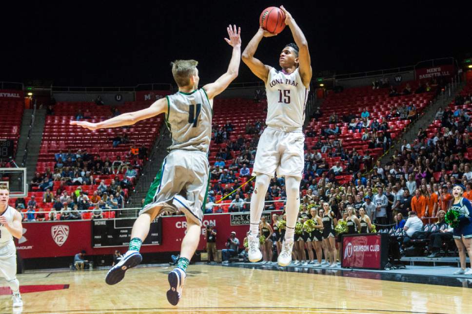 Chris Detrick  |  The Salt Lake Tribune
Lone Peak's Frank Jackson (15) shoots over Copper Hills' Sheldon Chatelain (4) during the 5A boy's basketball tournament at the Huntsman Center at the University of Utah Thursday March 3, 2016. Copper Hills is winning the game 33-22 at halftime.