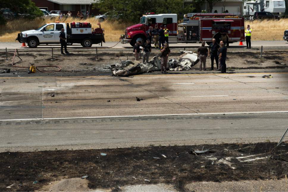 Rick Egan  |  The Salt Lake Tribune

Police investigate the plane crash that killed four people in the median of I-15 freeway, around 1:00pm. The crash closed the freeway to northbound traffic, Wednesday, July 26, 2017.