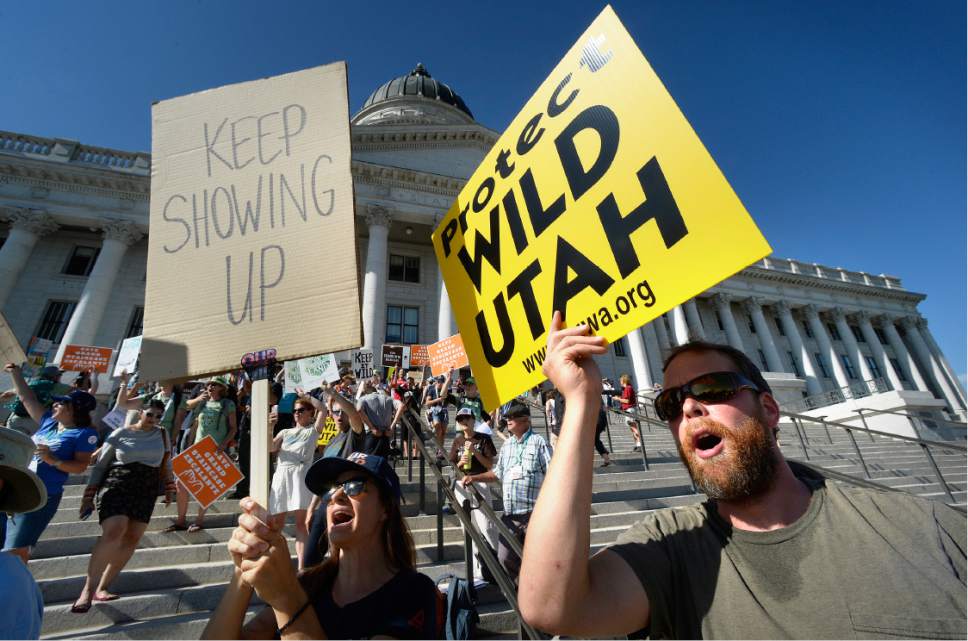 Scott Sommerdorf   |  The Salt Lake Tribune  
Eric Gessner, right, and others chanted slogans after marching from the Salt Palace to the Utah State Capitol in the "This Land is Our Land March for Public Lands", Thursday, July 27, 2017.