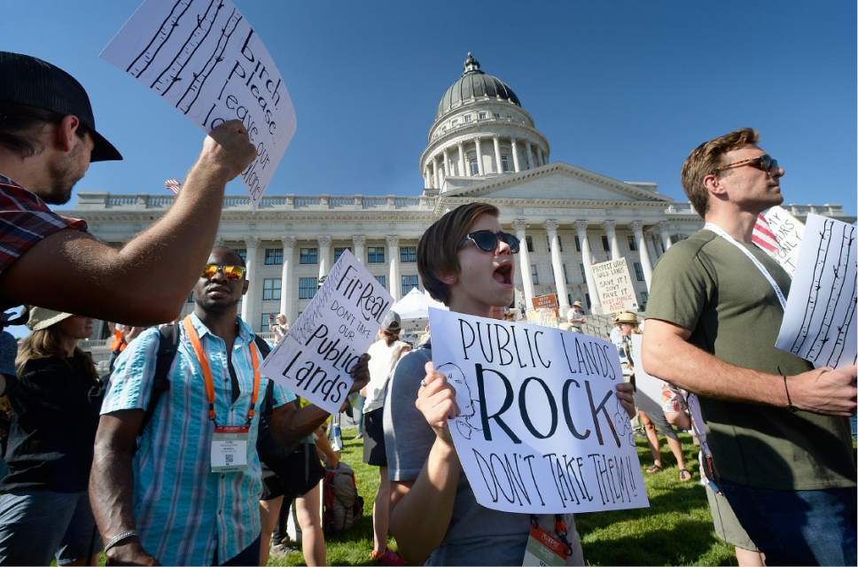 Scott Sommerdorf   |  The Salt Lake Tribune  
Erika Derilo, center, and others chanted slogans after marching from the Salt Palace to the Utah State Capitol in the "This Land is Our Land March for Public Lands", Thursday, July 27, 2017.