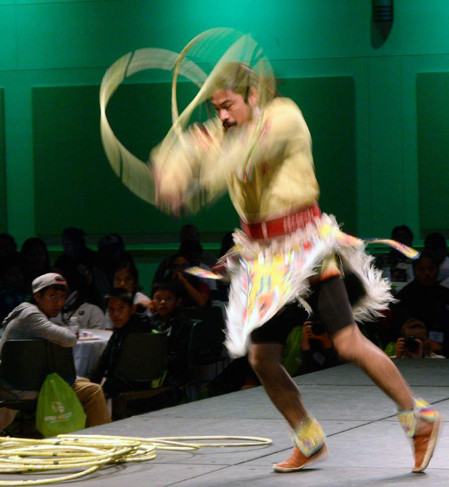 Al Hartmann  |  The Salt Lake Tribune
Carl Moore, Jr., a member of the Hopi Tribe, performs a hoop dance at the 2017 Governor's Native American Summit at Utah Valley University in Orem on Thursday, July 20, 2017. Native Americans from Utah tribes gathered to discuss educational and economic success, strengthening family relationships and celebrating native culture.