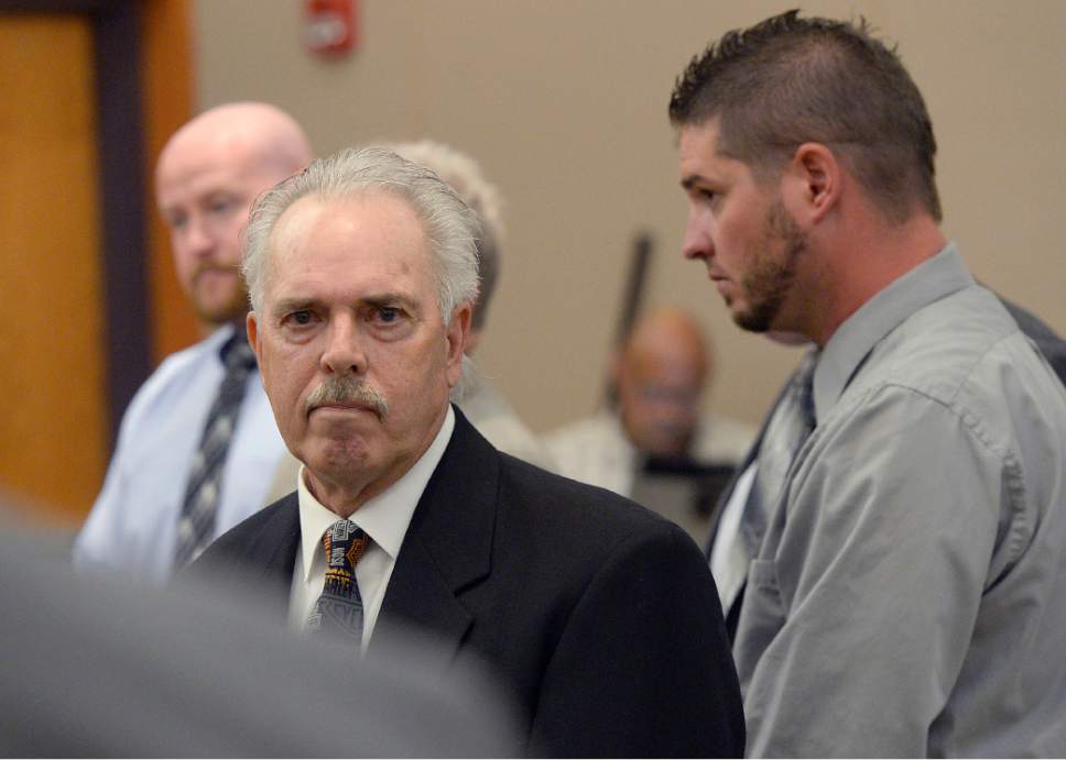 Al Hartmann  |  The Salt Lake Tribune
Former Daggett County Sheriff Jerry Jorgensen, front left, huddles with lawyers and former jail commander Lt. Benjamin Lail, right, in Third District Court in Park City Monday July 17 before Judge Kent Holmberg on charges connected to the abuse of jail inmates at the Daggett County jail. A third person charged at far left is Deputy Joshua Cox.