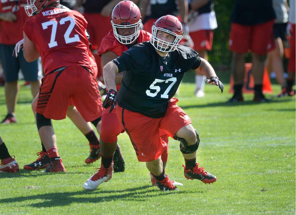 Scott Sommerdorf   |  The Salt Lake Tribune  
Utah LB Cody Ippolito spins out of a block during the first day of Utah fall football camp, Friday, July 28, 2017.