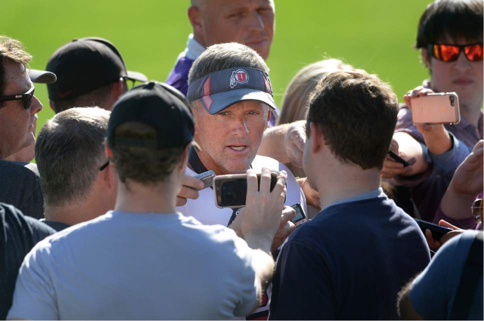 Scott Sommerdorf   |  The Salt Lake Tribune  
Utah head coach Kyle Whittingham speaks with a group of reporters after the first day of Utah fall football camp, Friday, July 28, 2017.