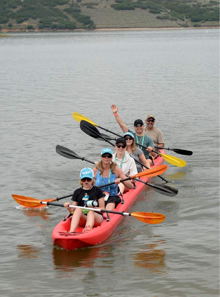 Al Hartmann  |  The Salt Lake Tribune
Participants in Outdoor Retailer try out new watercraft at Demonstration 
experience at Jordanelle  State Park Tuesday July 25. Six folks tour in a modular sit-on-top kayak made by Point 65 from Sweden.  The front and back pieces can accomadate as many modules for passengers as needed.  It is the last time the event will be held in Utah.