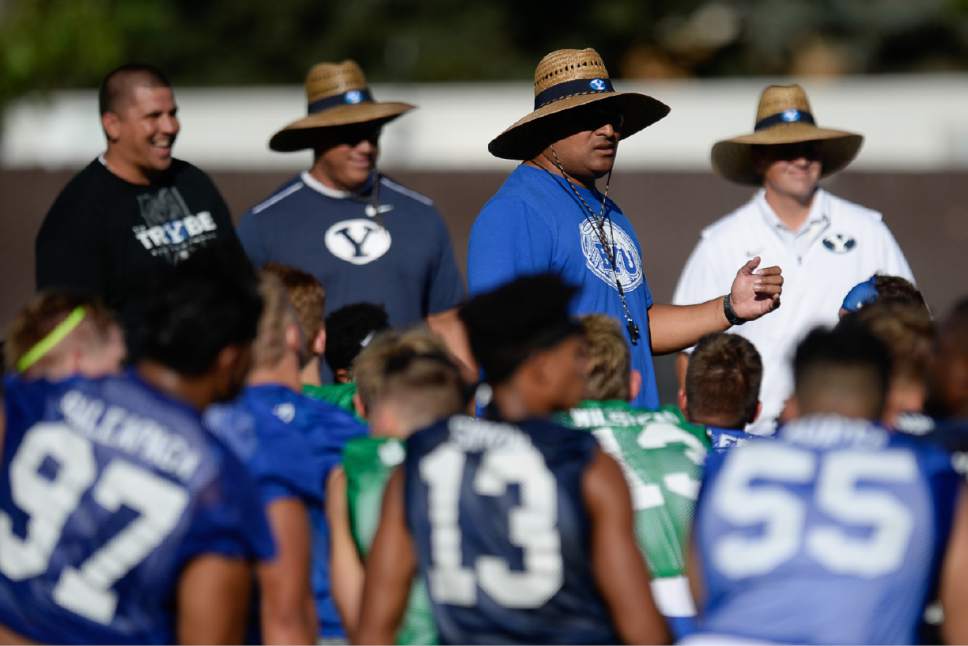 Francisco Kjolseth | The Salt Lake Tribune
BYU football coach Kalani Sitake, center right, begins preparations for the season with preseason training camp on Thursday, July 27, 2017, at their practice field in Provo.
