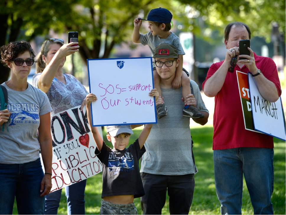 Scott Sommerdorf   |  The Salt Lake Tribune  
Marchers gathered under the trees at City Hall prior to marching around the building to bring awareness to their cause. 
Utah's largest labor unions joined with political advocates in a march in downtown Salt Lake City in support of public education -- and in opposition to new polices and budget proposals from President Trump and his Education Secretary Betsy DeVos, Saturday, July 29, 2017.