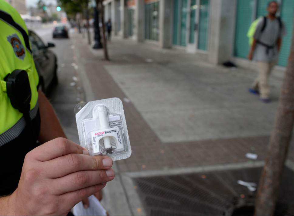 Al Hartmann  |  The Salt Lake Tribune
Salt Lake City police officer Sgt. Sam Wolf who patrols the Rio Grande neighborhood holds a dose of Narcan nasal spray he carries to help revive heroin overdose vicitims.