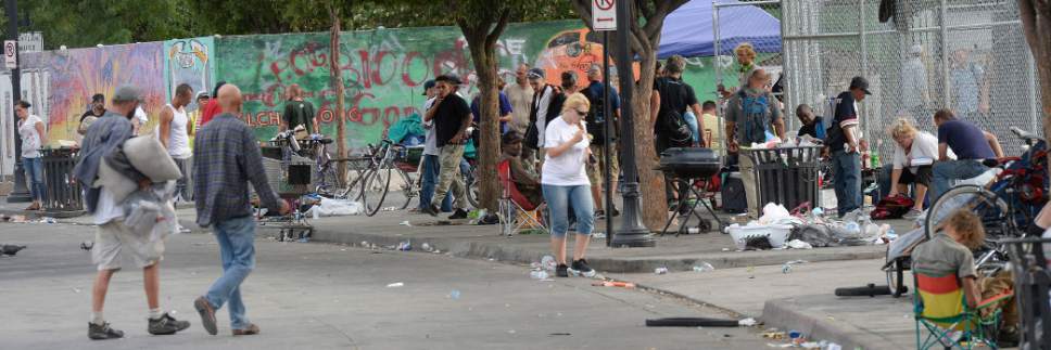 Al Hartmann  |  The Salt Lake Tribune
Scene along 500 West between 200 and 300 S. Wednesday July 19.  Many homeless people sleep on sidewalk with their belongings and makeshift shelters.  Camping on the street is a class B misdemeanor and can now be enforced.