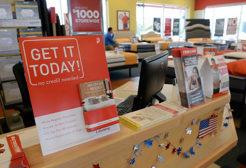 Al Hartmann  |  The Salt LakeTribune
Progressive Leasing brochures in the showroom at Mattress Firm in Draper. Mattress Firm is one of the retailers that uses Progressive Leasing to finance some of its sales.