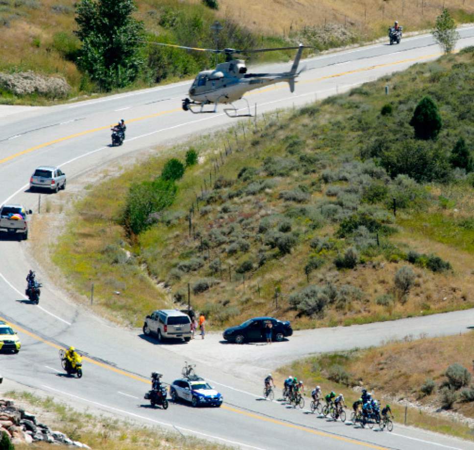 Steve Griffin  |  The Salt Lake Tribune


A helicopter, filming the event, hovers over a 10 man breakaway group as they head back up Logan Canyon during Stage 1 of the Tour of Utah bicycle race Monday July 31, 2017. Racers started in Logan and rode around Bear Lake before heading back to Logan for the finish.